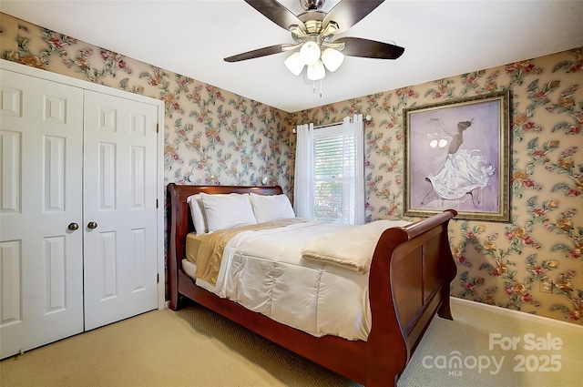 29049 Snapper Pt, Tega Cay, SC 29708 - bedroom with wallpapered walls, carpet, a closet, and a ceiling fan