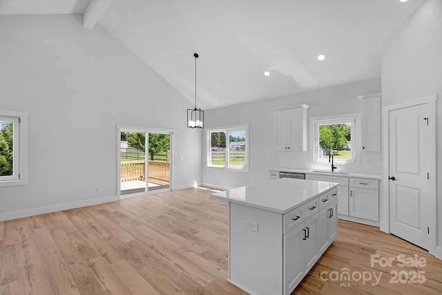 2104 County Line Rd, Kings Mountain, NC 28086 - kitchen featuring high vaulted ceiling, a sink, light countertops, white cabinets, and pendant lighting
