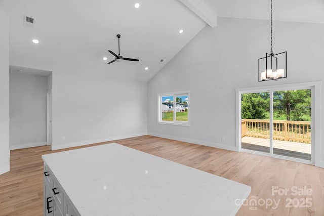 2104 County Line Rd, Kings Mountain, NC 28086 - unfurnished living room featuring high vaulted ceiling, healthy amount of natural light, a ceiling fan, a chandelier, and beam ceiling