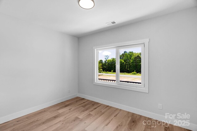 2104 County Line Rd, Kings Mountain, NC 28086 - spare room featuring baseboards and light wood-type flooring