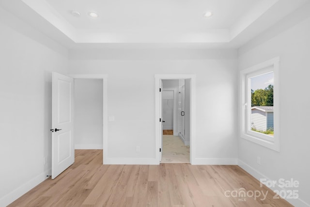 2104 County Line Rd, Kings Mountain, NC 28086 - unfurnished bedroom with a raised ceiling, light wood-style floors, baseboards, and recessed lighting