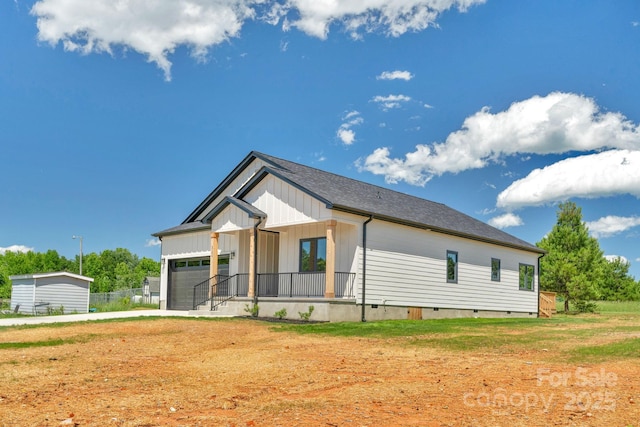 2104 County Line Rd, Kings Mountain, NC 28086 - modern farmhouse featuring a garage, crawl space, covered porch, a front yard, and board and batten siding
