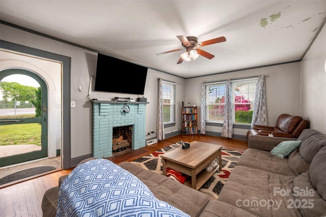 123 N Poston St, Shelby, NC 28150 - living area featuring a ceiling fan, a fireplace, and hardwood / wood-style flooring