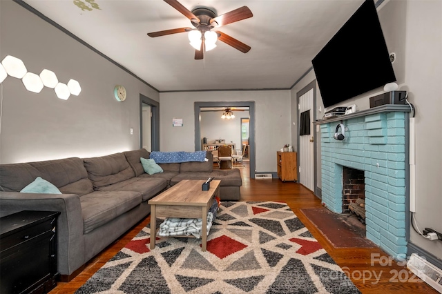 123 N Poston St, Shelby, NC 28150 - living area with a ceiling fan, wood finished floors, a brick fireplace, and ornamental molding