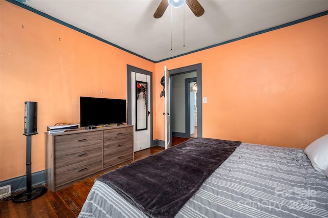 123 N Poston St, Shelby, NC 28150 - bedroom with dark wood finished floors, baseboards, crown molding, and a ceiling fan