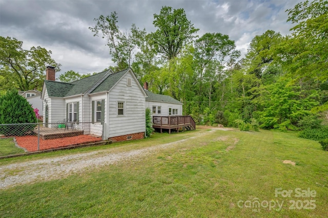 123 N Poston St, Shelby, NC 28150 - view of home's exterior featuring a chimney, a deck, and roof with shingles