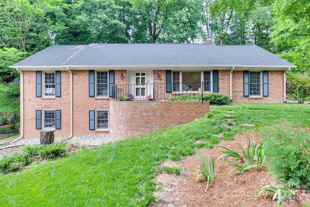 6626 Rocky Falls Rd, Charlotte, NC 28211 - view of front of home featuring a front lawn, brick siding, and a shingled roof