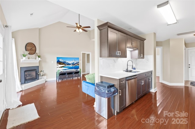 4809 Mossy Cup Ln, Monroe, NC 28110 - kitchen featuring dishwasher, a sink, a ceiling fan, dark wood finished floors, and light countertops