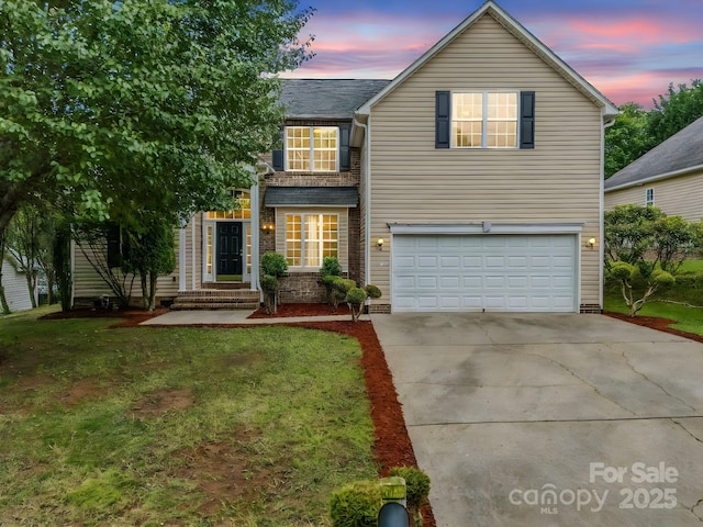 24 Yorktown Cir, Arden, NC 28704 - traditional-style house with concrete driveway, an attached garage, and a front yard