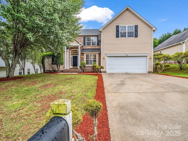 24 Yorktown Cir, Arden, NC 28704 - traditional home featuring a garage, concrete driveway, and a front lawn