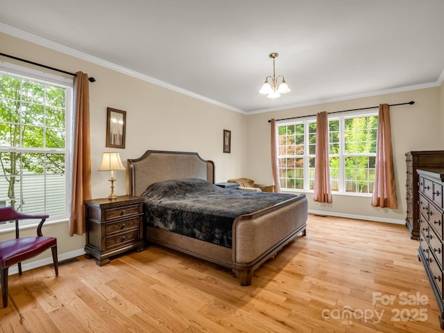 24 Yorktown Cir, Arden, NC 28704 - bedroom featuring light wood-style floors, baseboards, ornamental molding, and a chandelier