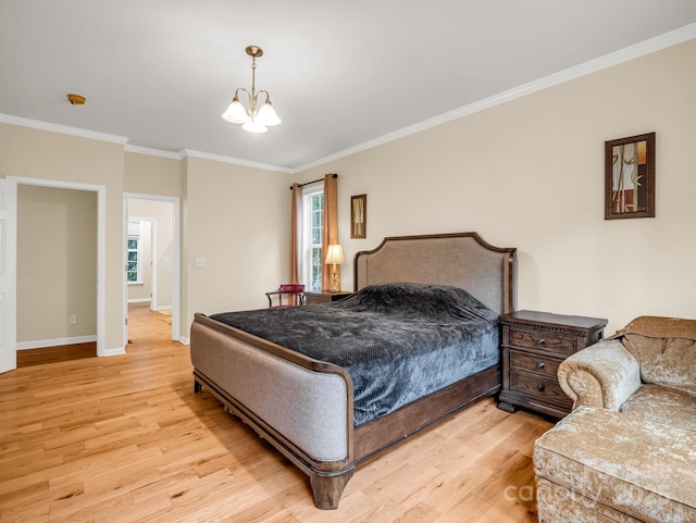 24 Yorktown Cir, Arden, NC 28704 - bedroom with light wood-type flooring, crown molding, a chandelier, and baseboards