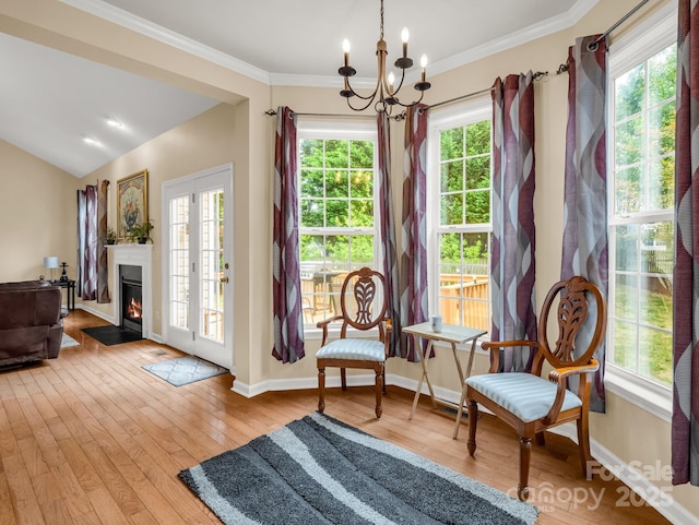 24 Yorktown Cir, Arden, NC 28704 - sitting room with healthy amount of natural light, a chandelier, wood-type flooring, baseboards, and crown molding