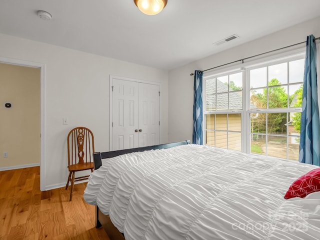 24 Yorktown Cir, Arden, NC 28704 - bedroom with light wood-type flooring, baseboards, and a closet