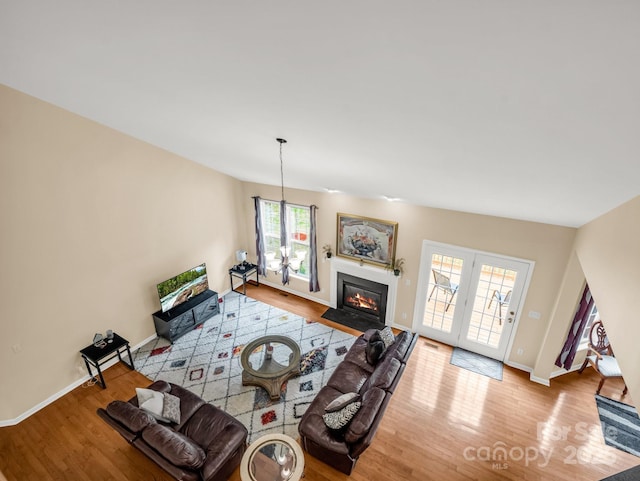 24 Yorktown Cir, Arden, NC 28704 - living room featuring wood finished floors, baseboards, and a fireplace with flush hearth