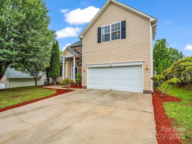 24 Yorktown Cir, Arden, NC 28704 - traditional-style house featuring a garage, driveway, and a front lawn