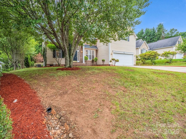 24 Yorktown Cir, Arden, NC 28704 - view of property hidden behind natural elements with a garage, driveway, and a front yard