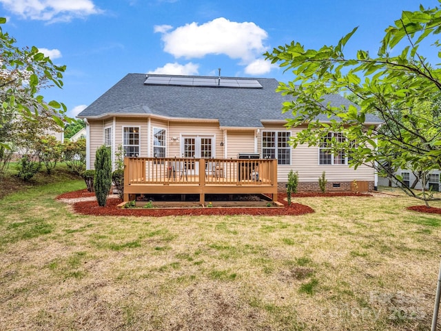24 Yorktown Cir, Arden, NC 28704 - rear view of house featuring roof with shingles, a lawn, a deck, and solar panels