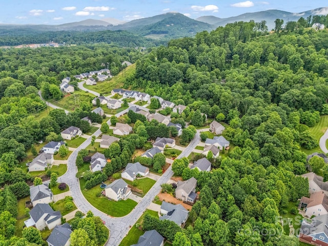 24 Yorktown Cir, Arden, NC 28704 - aerial perspective of suburban area with a heavily wooded area and a mountainous background