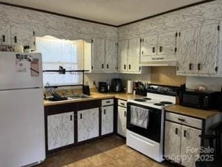 105 Overbrook Rd, Salisbury, NC 28147 - kitchen with white appliances, under cabinet range hood, tile patterned floors, and light countertops