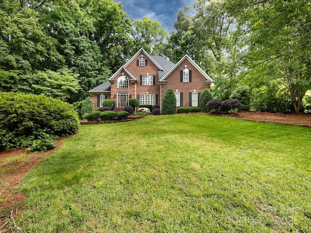5816 Valley Stream Trl, Waxhaw, NC 28173 - view of front facade with brick siding and a front lawn