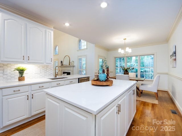 5816 Valley Stream Trl, Waxhaw, NC 28173 - kitchen featuring a sink, a center island, a chandelier, healthy amount of natural light, and recessed lighting