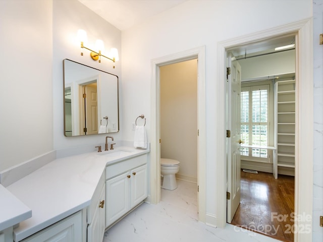 5816 Valley Stream Trl, Waxhaw, NC 28173 - bathroom featuring toilet, vanity, and baseboards