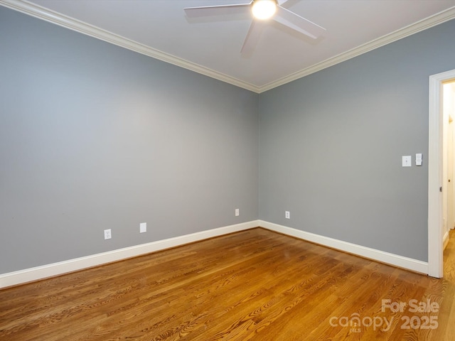 5816 Valley Stream Trl, Waxhaw, NC 28173 - unfurnished room with crown molding, baseboards, a ceiling fan, and wood finished floors