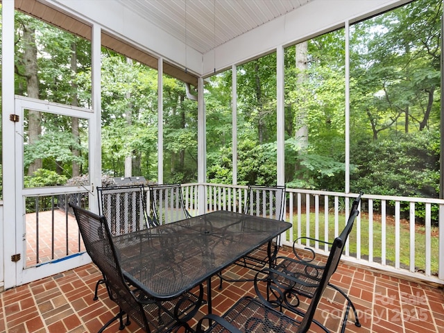 5816 Valley Stream Trl, Waxhaw, NC 28173 - sunroom / solarium featuring outdoor dining space and view of wooded area