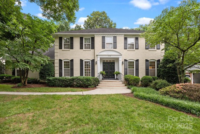 2709 Wamath Dr, Charlotte, NC 28210 - view of front of home with a front lawn and a shingled roof