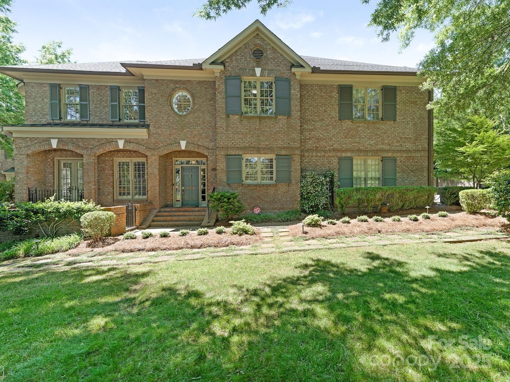 4026 Barclay Downs Dr, Charlotte, NC 28209 - view of front of property with brick siding and a front yard