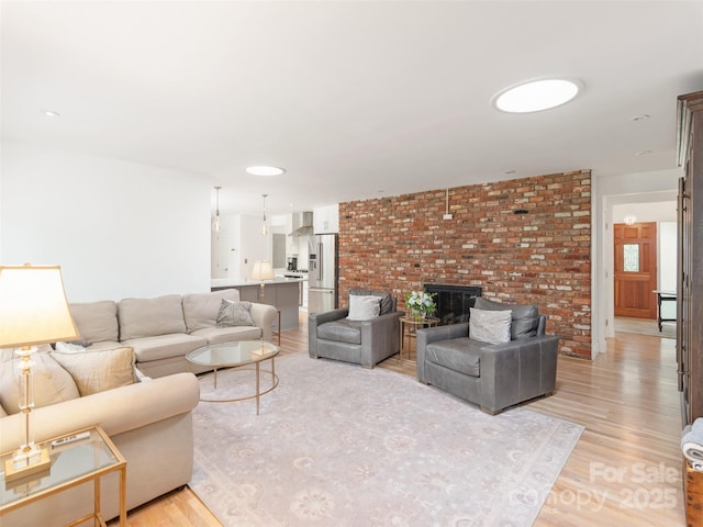 6 Browntown Rd, Asheville, NC 28803 - living room featuring light wood-style floors and a fireplace