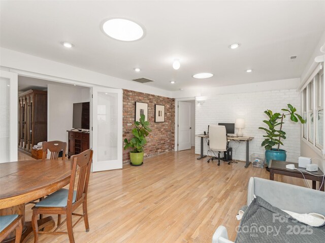 6 Browntown Rd, Asheville, NC 28803 - office area with brick wall, light wood finished floors, and recessed lighting