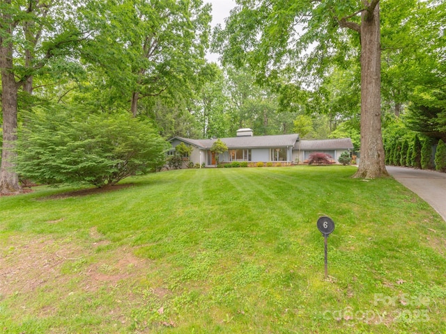 6 Browntown Rd, Asheville, NC 28803 - ranch-style house featuring a chimney, a front yard, and driveway