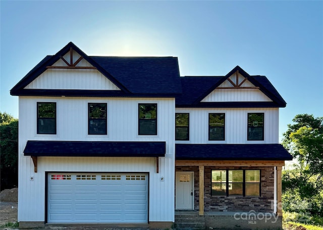 1308 Austin Chaney Rd, Wingate, NC 28174 - modern farmhouse style home featuring a shingled roof, an attached garage, covered porch, and driveway