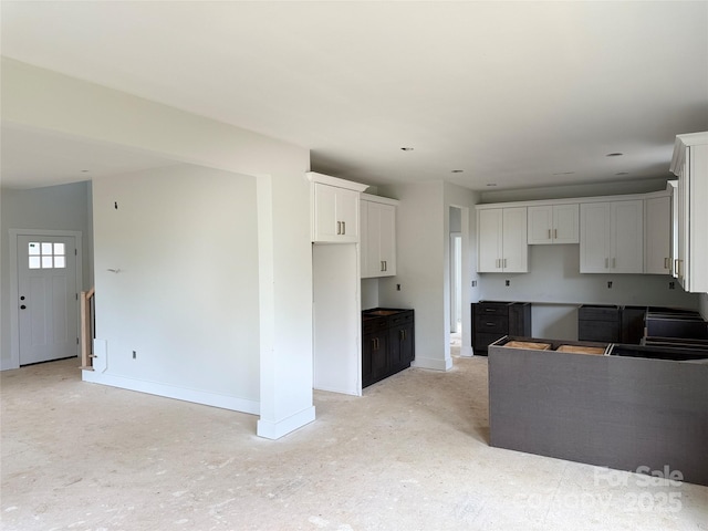 1308 Austin Chaney Rd, Wingate, NC 28174 - kitchen with baseboards and white cabinets