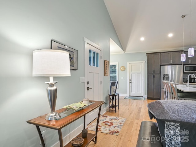 26 Addison Fisher Way, Asheville, NC 28805 - living room with vaulted ceiling, light wood-style floors, recessed lighting, ornamental molding, and baseboards