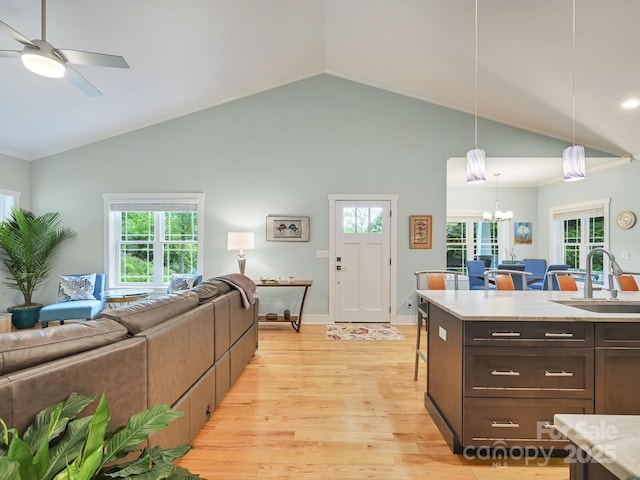 26 Addison Fisher Way, Asheville, NC 28805 - kitchen with open floor plan, a sink, light wood-style floors, vaulted ceiling, and light countertops
