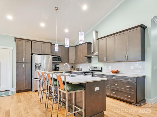 26 Addison Fisher Way, Asheville, NC 28805 - kitchen featuring wall chimney range hood, appliances with stainless steel finishes, ornamental molding, a sink, and decorative backsplash