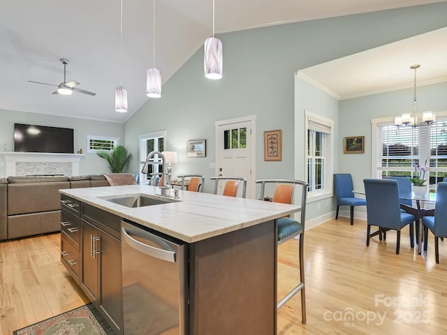 26 Addison Fisher Way, Asheville, NC 28805 - kitchen with dishwasher, a sink, light wood-type flooring, decorative light fixtures, and a kitchen breakfast bar