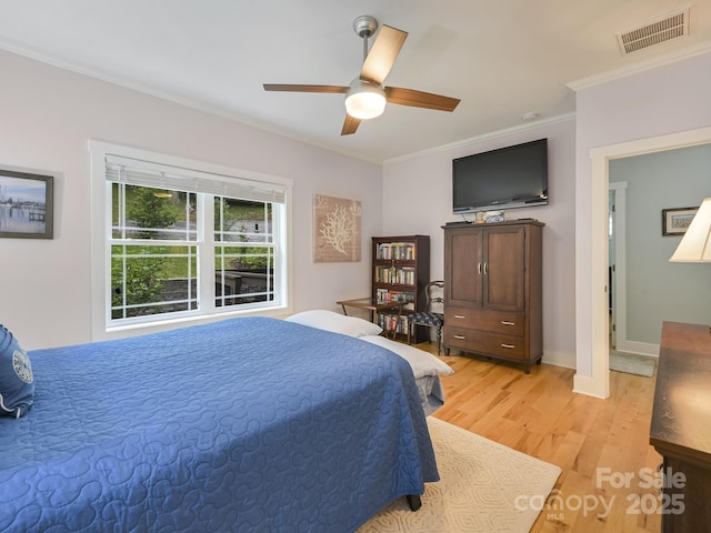 26 Addison Fisher Way, Asheville, NC 28805 - bedroom with light wood finished floors, ornamental molding, ceiling fan, and baseboards