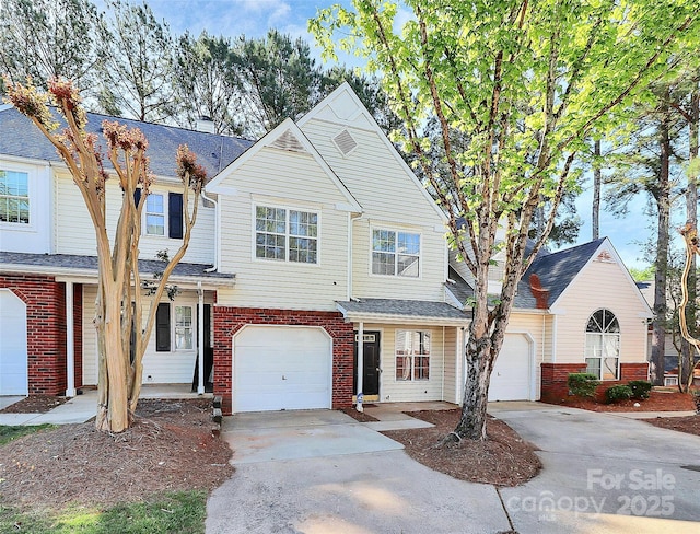 5953 Prescott Ct Unit 3105, Charlotte, NC 28269 - view of front of property with driveway, brick siding, and an attached garage