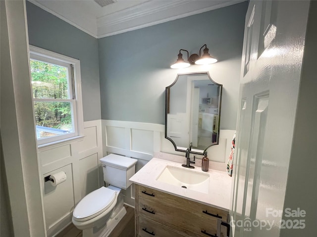 3314 Mara Ct, Matthews, NC 28105 - bathroom with toilet, vanity, crown molding, wainscoting, and a decorative wall