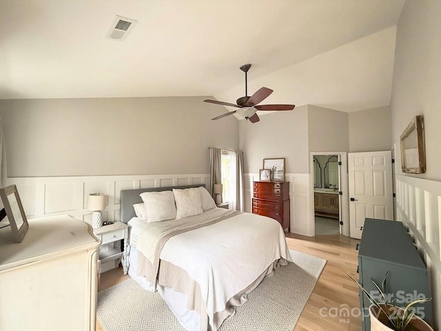 3314 Mara Ct, Matthews, NC 28105 - bedroom featuring lofted ceiling, light wood-type flooring, wainscoting, and ceiling fan