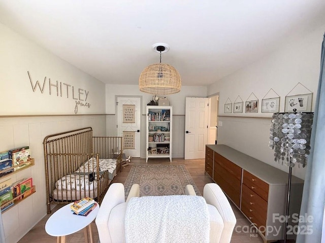 3314 Mara Ct, Matthews, NC 28105 - bedroom featuring a nursery area and wood finished floors