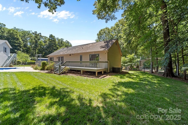 1827 Beckner Rd, Lexington, NC 27292 - rear view of property with a deck, an outdoor pool, and central AC