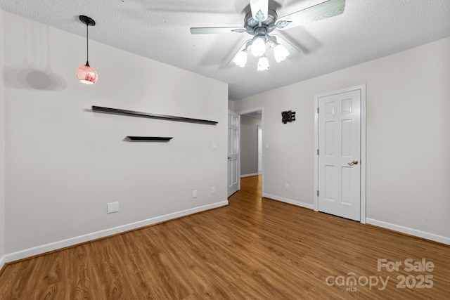 1827 Beckner Rd, Lexington, NC 27292 - empty room with wood finished floors, baseboards, and a ceiling fan