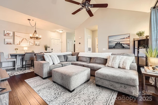 18605 Ruffner Dr Unit 3E, Cornelius, NC 28031 - living area featuring a ceiling fan, wood finished floors, high vaulted ceiling, and a chandelier