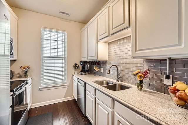 18605 Ruffner Dr Unit 3E, Cornelius, NC 28031 - kitchen featuring a sink, appliances with stainless steel finishes, baseboards, and tasteful backsplash