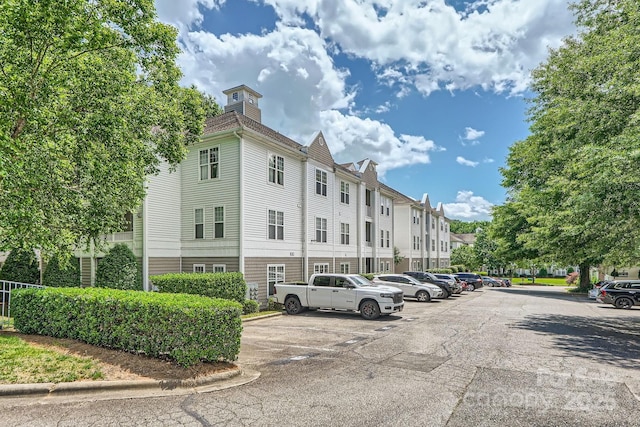 18605 Ruffner Dr Unit 3E, Cornelius, NC 28031 - view of building exterior featuring uncovered parking and a residential view